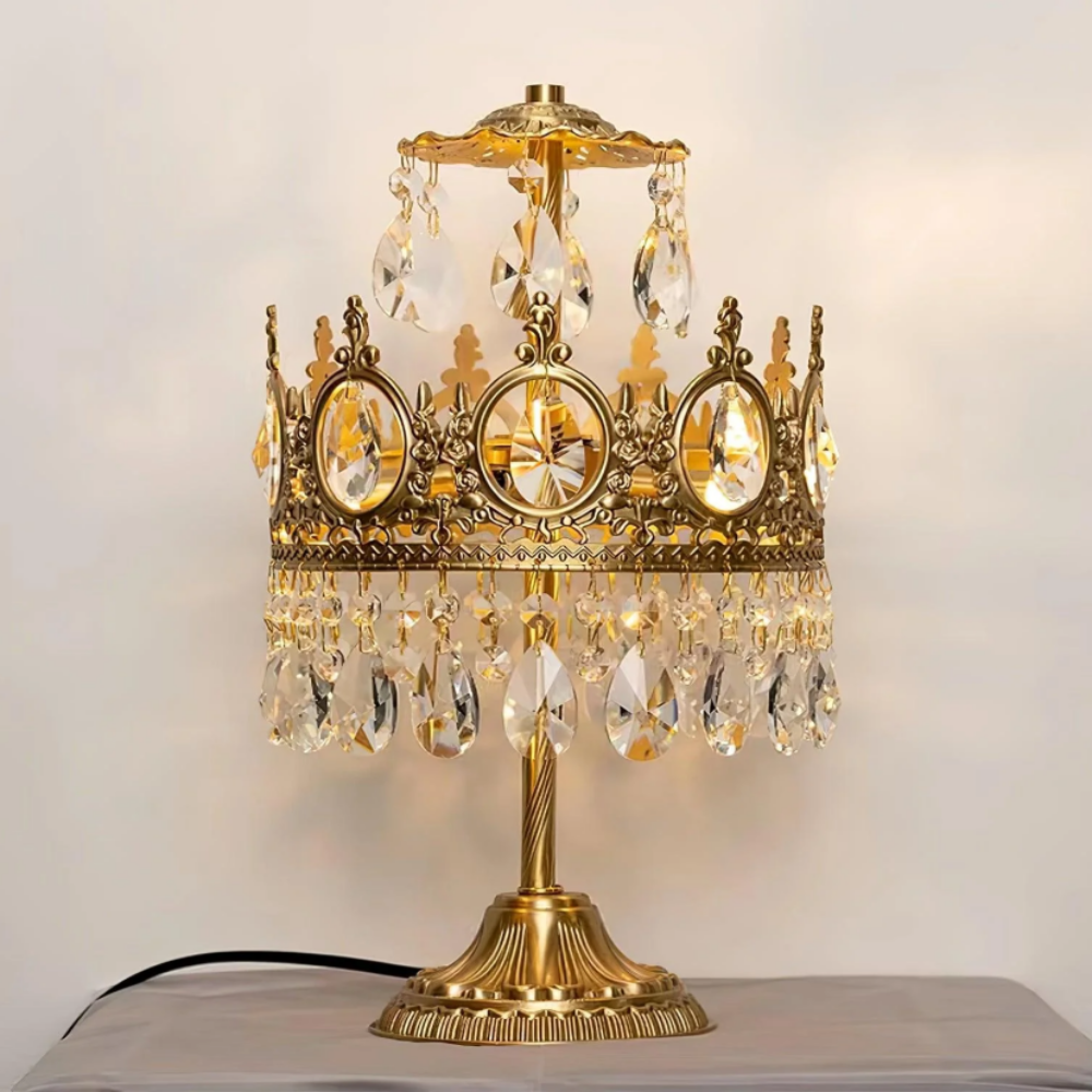 Vintage crystal table lamp with ornate gold base and hanging teardrop crystals